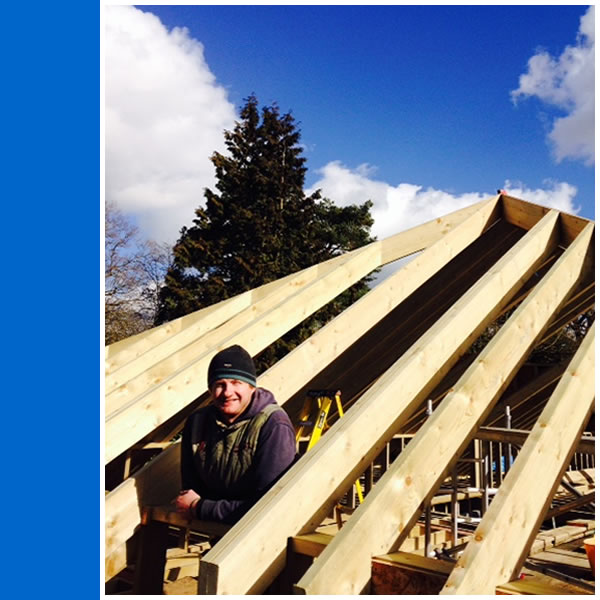 Photo of Neil Fletcher of NEF Carpentry working on a cut and pitch roof in Brockham.